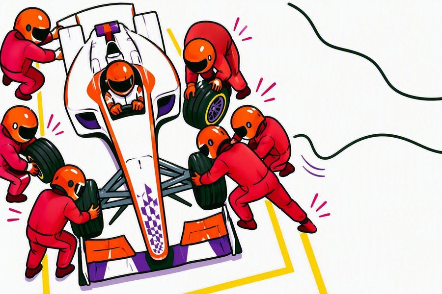 A pit crew changing the wheels of a racing car together